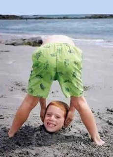 headless boy at the beach