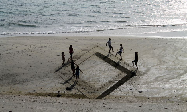 Climbing Stairs on the Beach Optical Illusion img