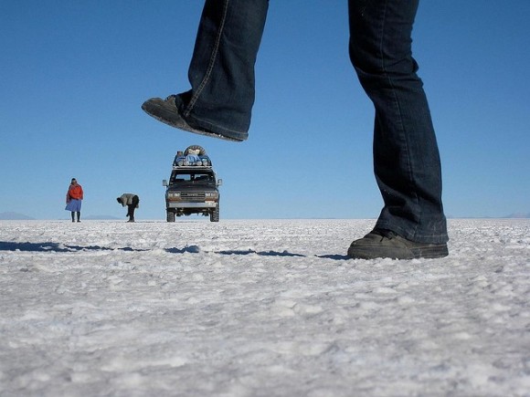 Giant In the Desert Stepping On Vehicle Optical Illusion