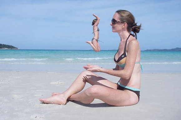 giant girl on the beach optical illusion