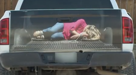 Abducted woman truck decal optical illusion