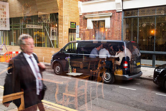 dining inside van reflection illusion 